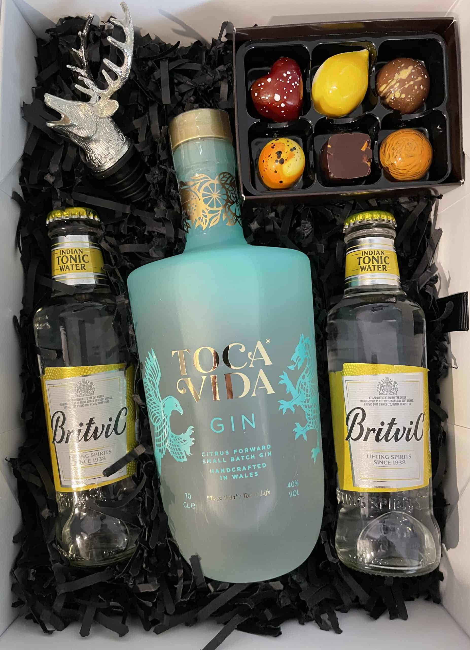 A Gift Box with a bottle of gin and chocolates.